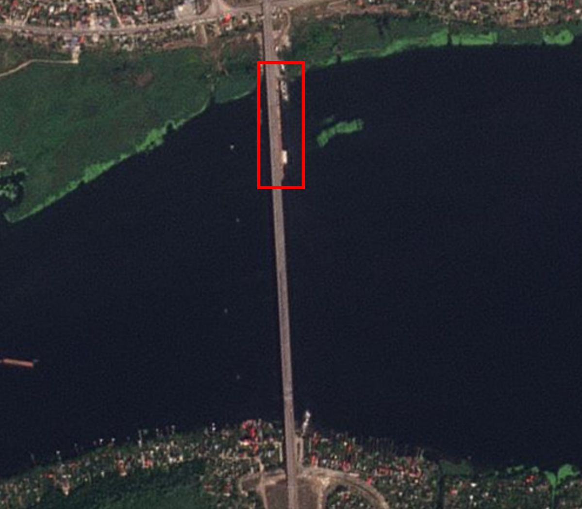 The beginning of a pontoon bridge can be seen alongside the Antonovsky Bridge on the north bank of the Dnipro River. <em>PHOTO © 2022 PLANET LABS INC. ALL RIGHTS RESERVED. REPRINTED BY PERMISSION</em>