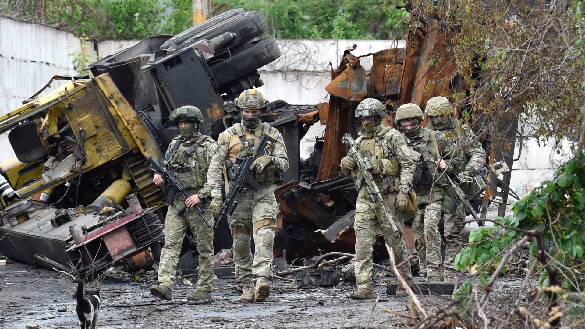 Russian servicemen patrol the destroyed part of the Ilyich Iron and Steel Works in Ukraine's port city of Mariupol on May 18, 2022, amid the ongoing Russian military action in Ukraine.