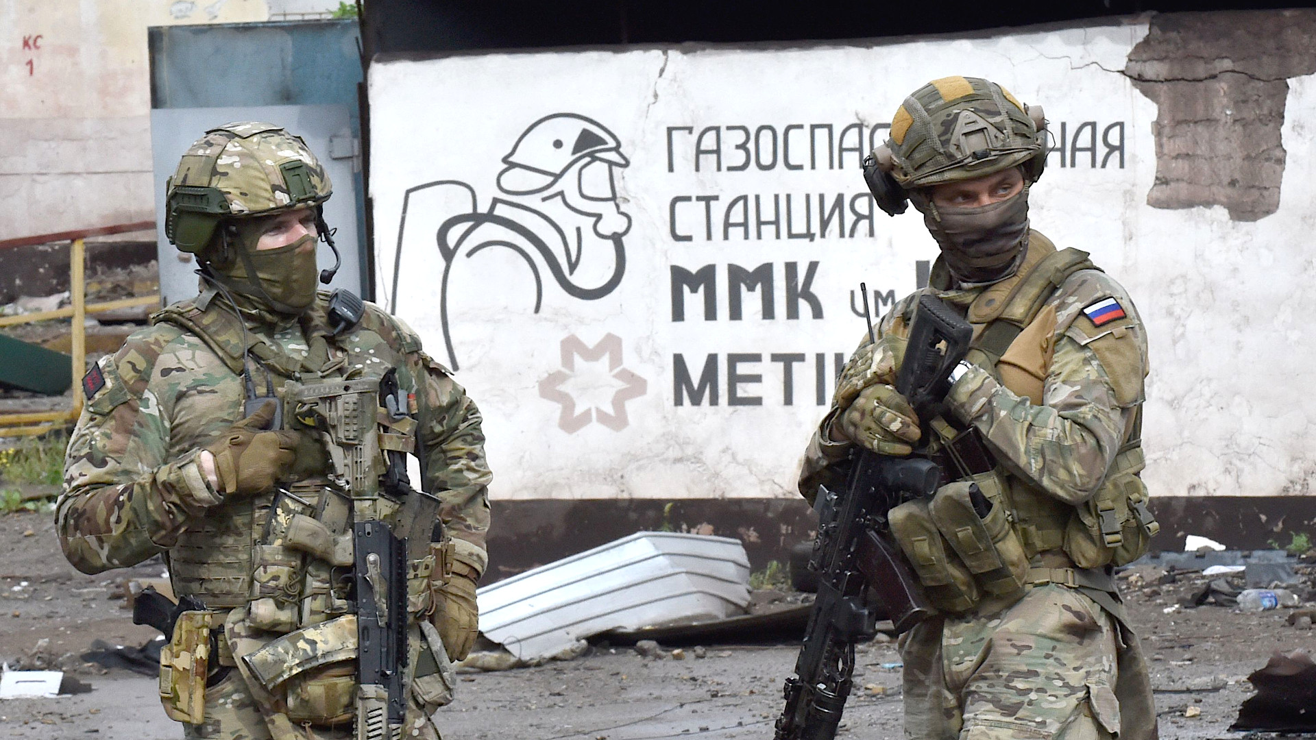 Russian servicemen stand guard at the destroyed part of the Ilyich Iron and Steel Works in Ukraine's port city of Mariupol on May 18, 2022, amid the ongoing Russian military action in Ukraine.