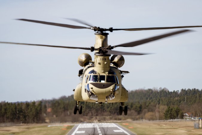 A U.S. Army CH-47F Chinook helicopter from Bravo Company, 1-214th General Support Aviation Battalion, 12th Combat Aviation Brigade, “Big Windy”, prepares to land during an air movement of a Congressional Delegation (CODEL) from Munich to the Grafenwoehr Training Area, Germany, April 12, 2022. Two CH-47Fs were used throughout the mission to provide precision rotary-wing aviation support and enable the CODEL to observe combined arms training, meet with forward-deployed Soldiers, and receive briefings from key U.S. Army leadership. 12 CAB is among other units assigned to V Corps, America's Forward Deployed Corps in Europe that works alongside NATO Allies and regional security partners to provide combat-ready forces, execute joint and multinational training exercises, and retains command and control for all rotational and assigned units in the European Theater. (U.S. Army photo by Staff Sgt. Thomas Mort)