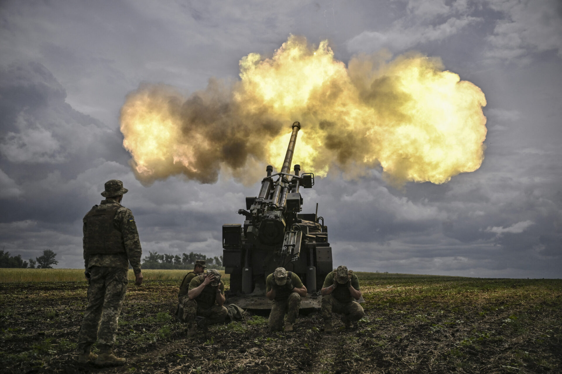 Ukrainian servicemen fire with a French self-propelled 155 mm/52-calibre gun Caesar towards Russian positions at a front line in the eastern Ukrainian region of Donbas on June 15, 2022. Photo by ARIS MESSINIS/AFP via Getty Images