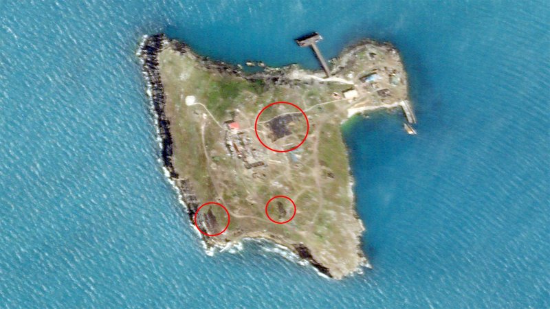 A satellite image of Ukraine's Zmiinyi Island, or Snake Island, in the Black Sea, which Russian forces currently occupy, taken on June 21, 2022. The red circles highlight areas that appear to have been hit in Ukrainian strikes.