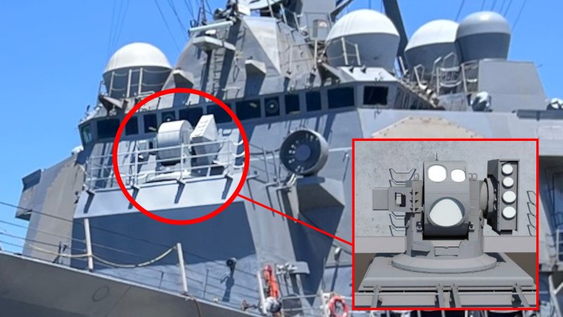 A look at the new High-Energy Laser with Integrated Optical Dazzler and Surveillance (HELIOS) laser directed energy weapon installed on the Arleigh Burke class destroyer USS Preble, with an inset showing a rendering of the system. (U.S. Navy/Lockheed Martin)