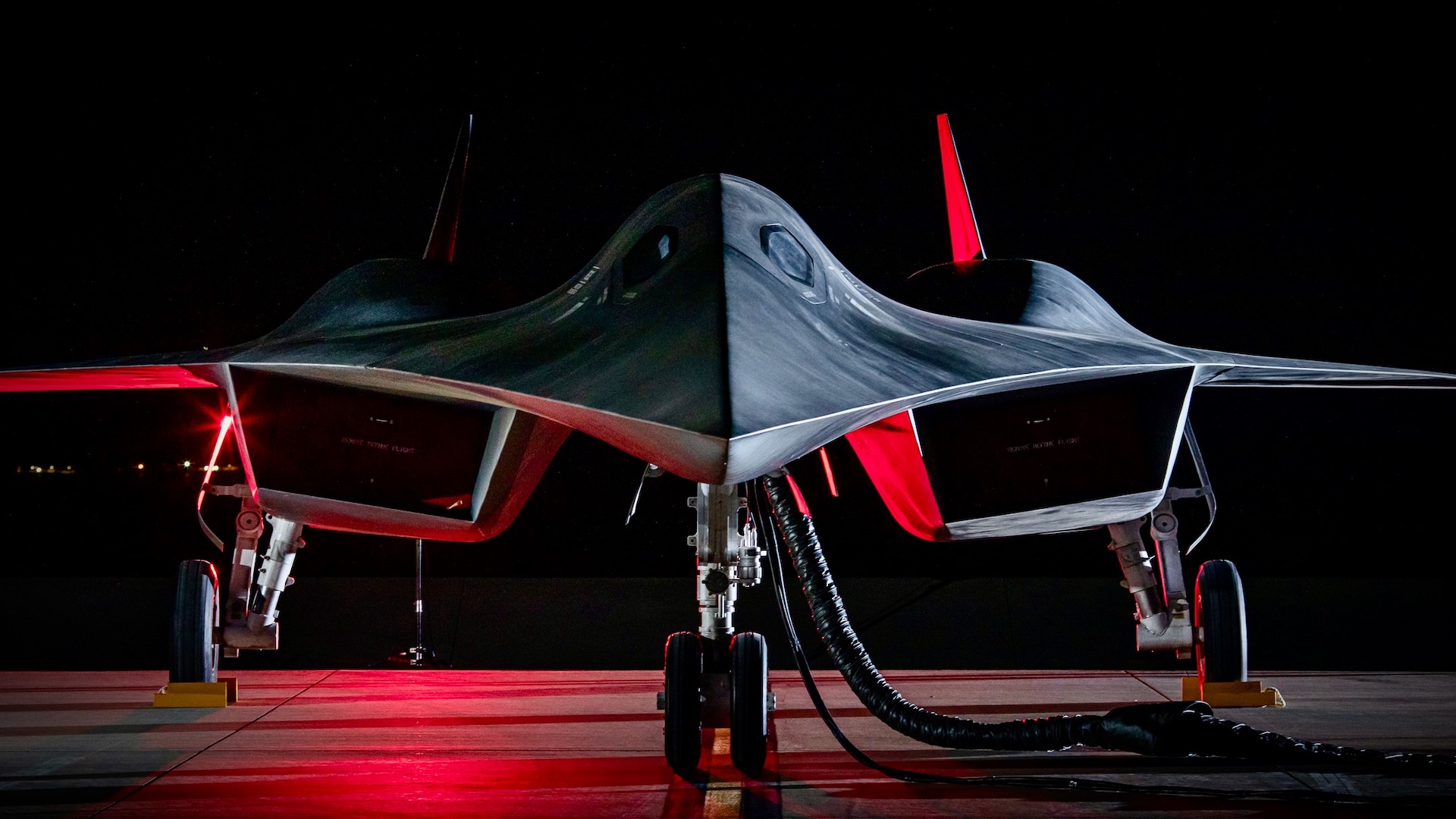 Lockheed Martin's Darkstar illuminated in red