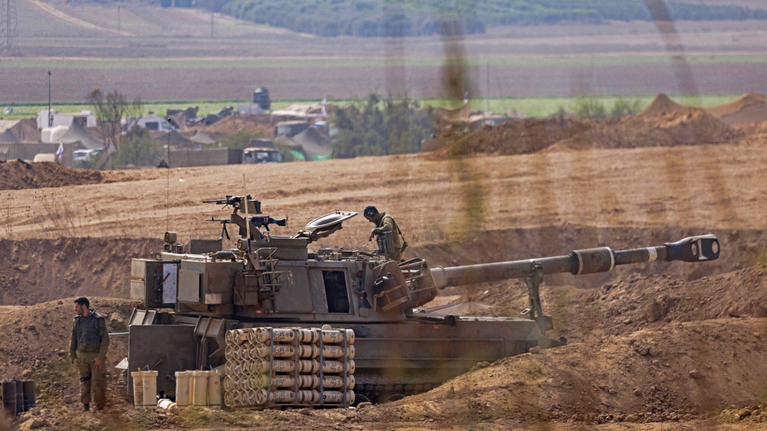 Israeli tanks and troops near the border with Gaza on October 28, 2023 in Sderot, Israel. In the wake of the Oct. 7 attacks by Hamas that left 1,400 dead and 200 kidnapped, Israel launched a sustained bombardment of the Gaza Strip and threatened a ground invasion to vanquish the militant group that governs the Palestinian territory. But the fate of the hostages, Israelis and foreign nationals who are being held by Hamas in Gaza, as well as international pressure over the humanitarian situation in Gaza, have complicated Israel's military response to the attacks. A timeline for a proposed ground invasion remains unclear.