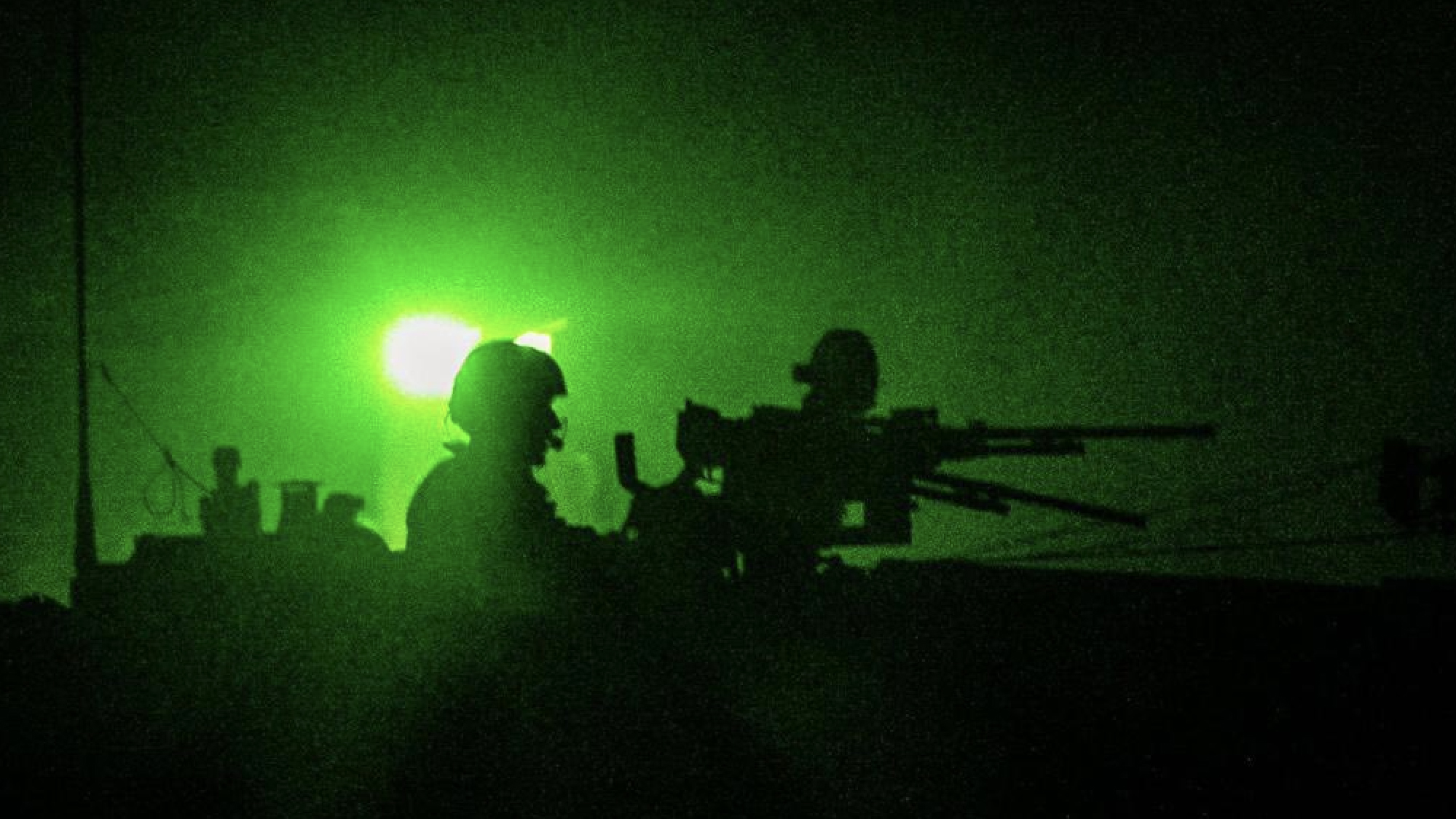 Israeli tank moves into Gaza at night.