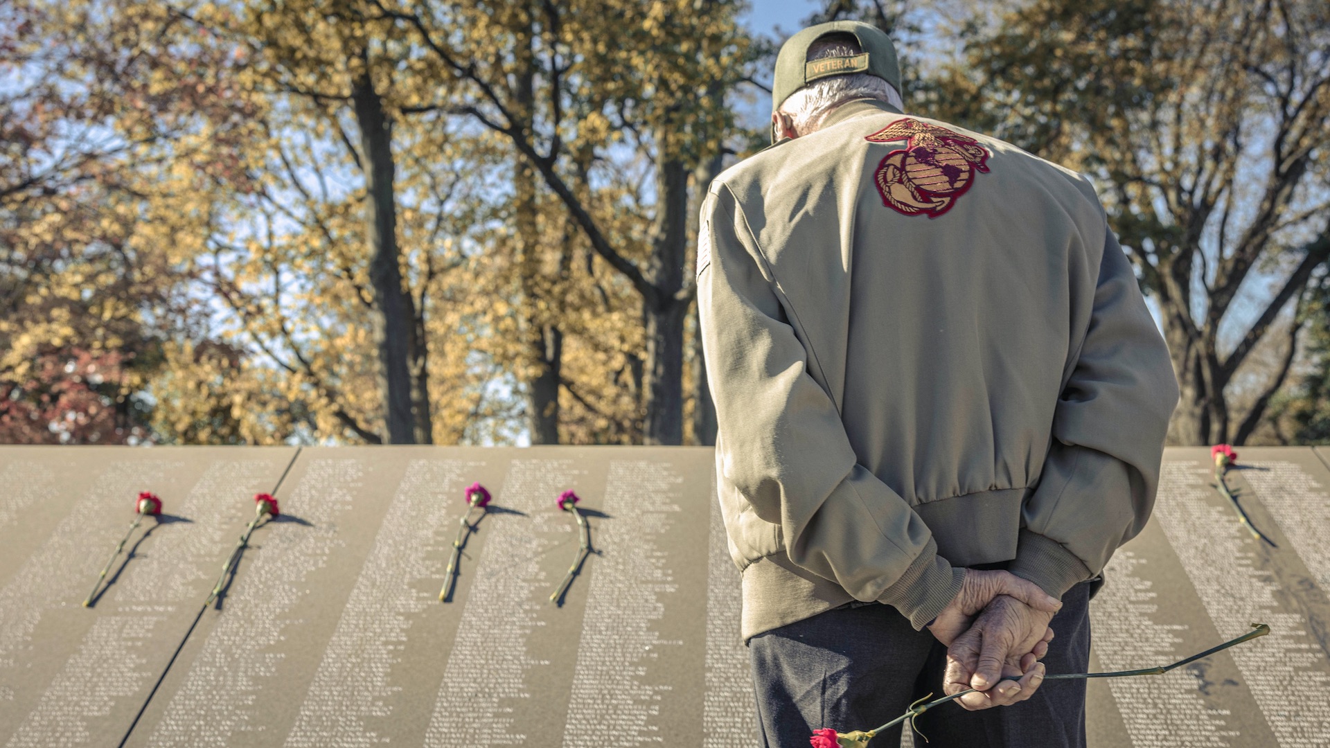 A U.S. Marine Corps Korean War veteran searches the names of those who lost their life during the Korean War at the Korean War Memorial during a reunion for those who fought at the Battle of the Chosin Reservoir in Washington, DC on Nov. 3, 2023. Veterans of the Battle of Chosin Reservoir, also known as The Chosin Few, traveled from across the country to meet with other Marines who fought by their side