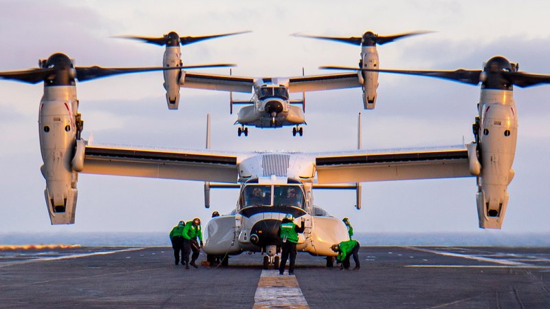 CMV-22Bs land on a carrier