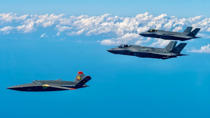 A U.S. Marine Corps XQ-58A Valkyrie, highly autonomous, low-cost tactical unmanned air vehicle, conducts its second test flight with two U.S. Air Force F-35A Lightning II aircraft assigned to 33rd Fighter Wing, 96th Test Wing at Eglin Air Force Base, Fla., Feb. 23, 2023. The XQ-58A Valkyrie test flight and the data collected inform future requirements for the Marine Corps in a rapidly evolving security environment, while successfully fueling joint innovation and experimentation opportunities. (U.S. Air Force photo by Master Sgt. John McRell)