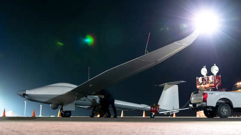 Unmanned Long-Endurance Tactical Reconnaissance Aircraft crew chiefs, assigned within the U.S. Central Command area of responsibility, prep an ULTRA aircraft for taxi across the flightline before an early morning takeoff at an undisclosed location, May 7, 2024. ULTRA is an unmanned aerial system capable of flight times up to 80 hours, providing intelligence, surveillance, and reconnaissance capabilities to combatant commanders, with a smaller operational footprint than other UAS in its class.