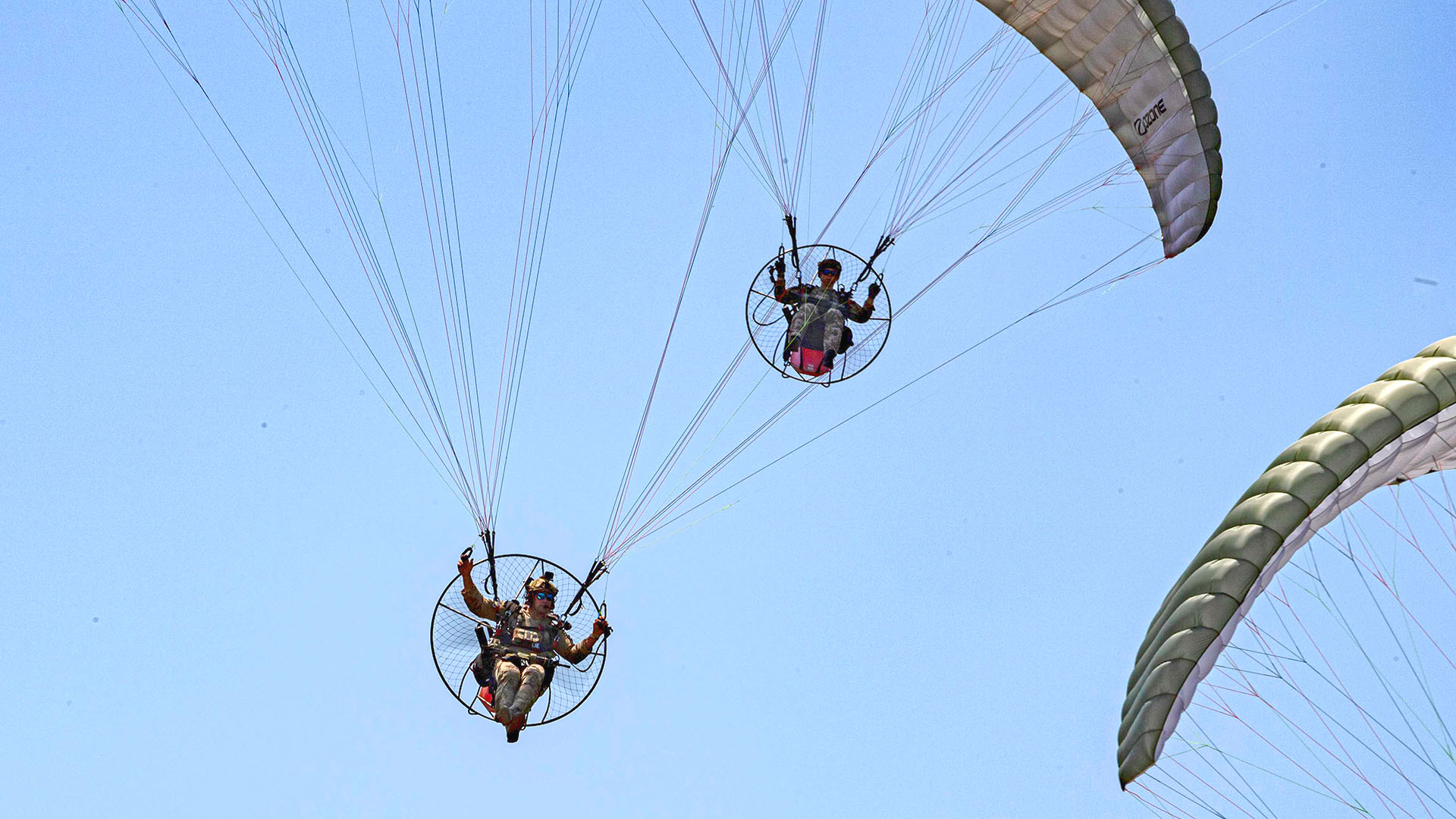 An annual special operations capability demonstration has included paragliding Marines on a mock drone hunt.