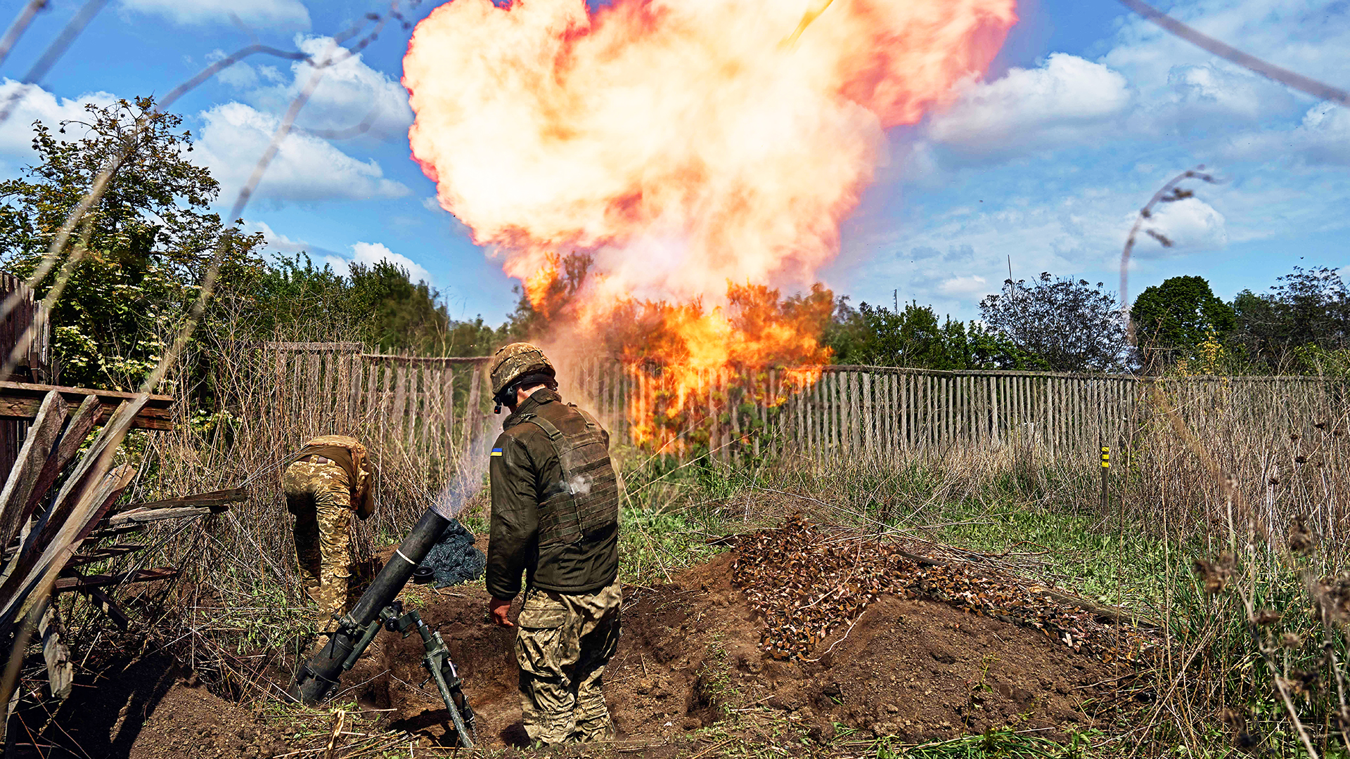 KHARKIV REGION, UKRAINE - MAY 18:  A mortar unit with a 120 mm mortar prepares to perform a combat mission on May 18, 2024 in the Kharkiv region, near the border with Russia. Ukrainian soldiers from the 92nd assault brigade were involved in holding back the Russians on the border with Russia. In recent days Russian forces have gained ground around the Kharkiv region, which Ukraine had largely reclaimed in the months following Russia's initial large-scale invasion in February 2022.