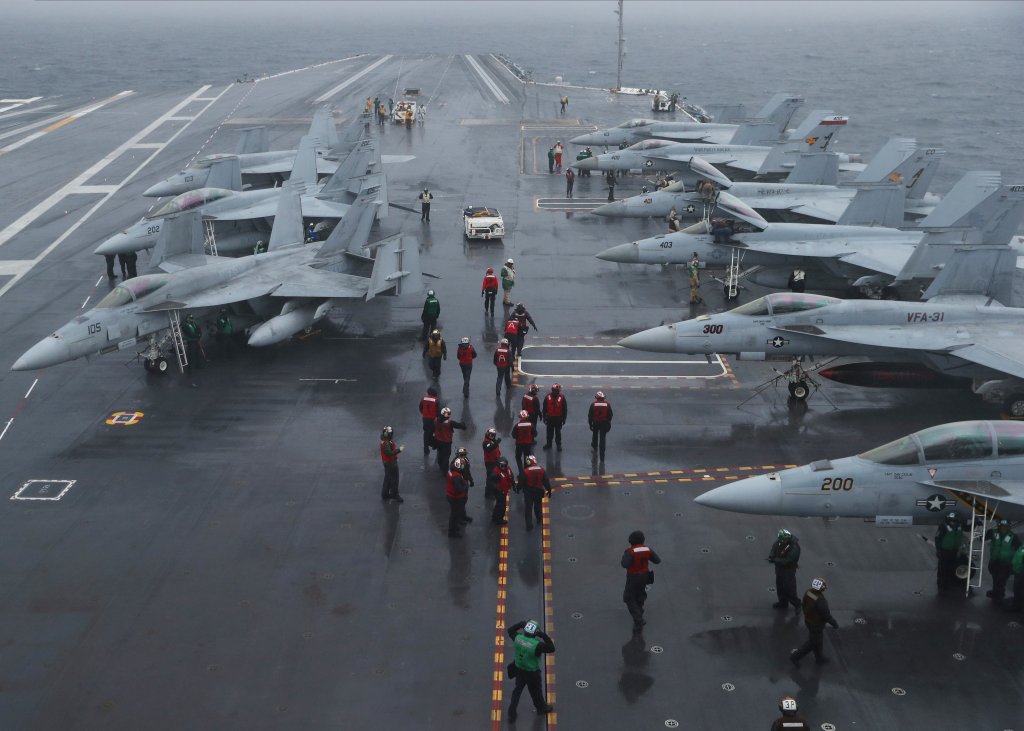 Sailors assigned to USS Gerald R. Ford (CVN 78) and Carrier Air Wing (CVW) 8 prepare for flight operations, March 25, 2022. Ford is underway in the Atlantic Ocean conducting flight deck certification and air wing carrier qualification as part of the ships tailored basic phase prior to operational deployment. (U.S. Navy photo by Mass Communication Specialist 2nd Class Nolan Pennington)