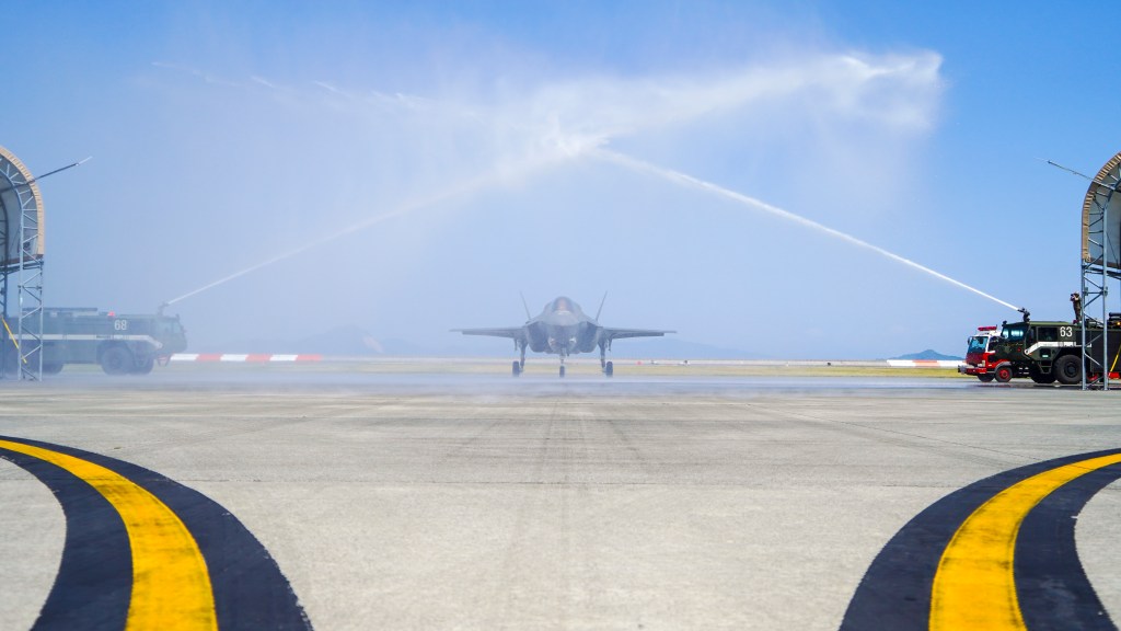 U.S. Marine Corps Lt. Col. Alexander Mellman, the commanding officer of Marine Fighter Attack Squadron (VMFA) 242, Marine Aircraft Group 12, 1st Marine Aircraft Wing, is washed down in an F-35B Lightning II aircraft after his final flight at Marine Corps Air Station Iwakuni, Japan, June 11, 2024. Mellman conducted his final flight in honor of his 20 years of service in the U.S. Marine Corps. Mellman is a native of Connecticut. (Courtesy photo by Lance Cpl. Logan Stone)