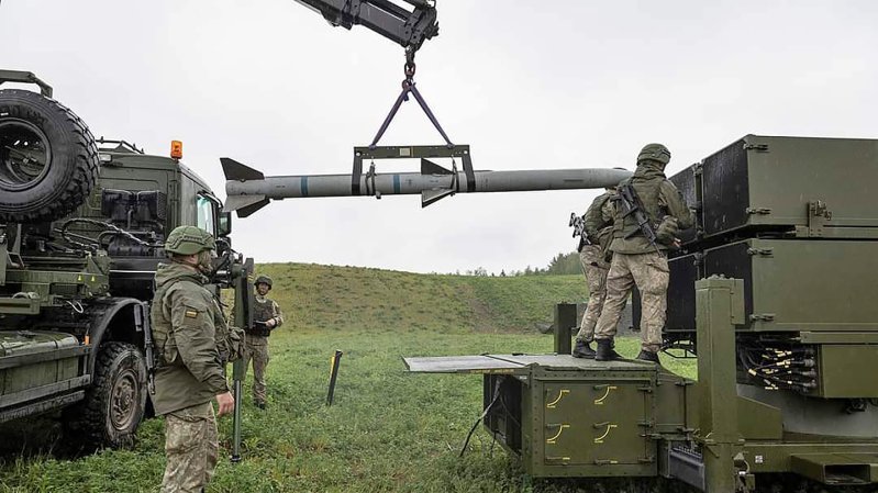 AIM-120 being loaded into a NASAMS launcher