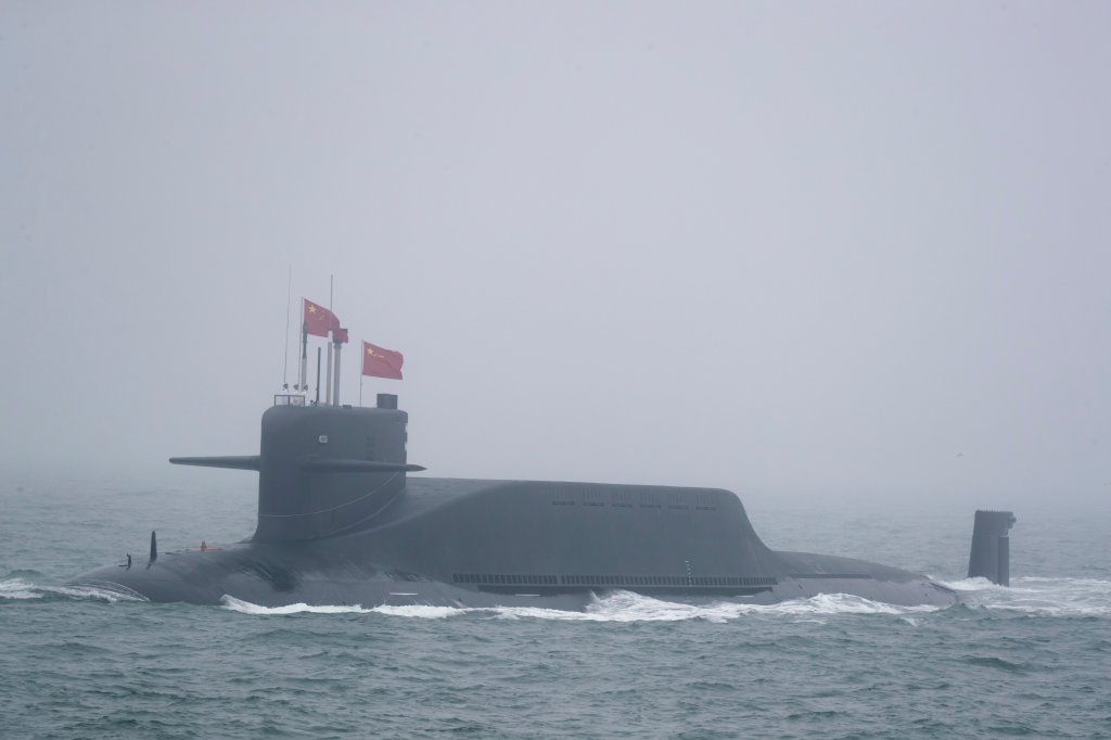 A new type 094A Jin-class nuclear submarine Long March 10 of the Chinese People's Liberation Army (PLA) Navy participates in a naval parade to commemorate the 70th anniversary of the founding of China's PLA Navy in the sea near Qingdao, in eastern China's Shandong province on April 23, 2019. - China celebrated the 70th anniversary of its navy by showing off its growing fleet in a sea parade featuring a brand new guided-missile destroyer. (Photo by Mark Schiefelbein / POOL / AFP) (Photo credit should read MARK SCHIEFELBEIN/AFP via Getty Images)