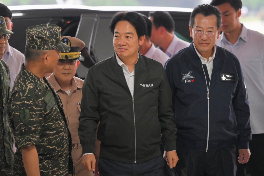 Taiwan President Lai Ching-te (C) and Defence Minister Wellington Koo arrive on a visit to inspect military troops in Taoyuan on May 23, 2024. Taiwan's President Lai Ching-te said he will "stand on the front line" to defend Taiwan, speaking on May 23 as China held war games around the self-ruled island days after he was sworn into office. (Photo by Sam Yeh / AFP) (Photo by SAM YEH/AFP via Getty Images)