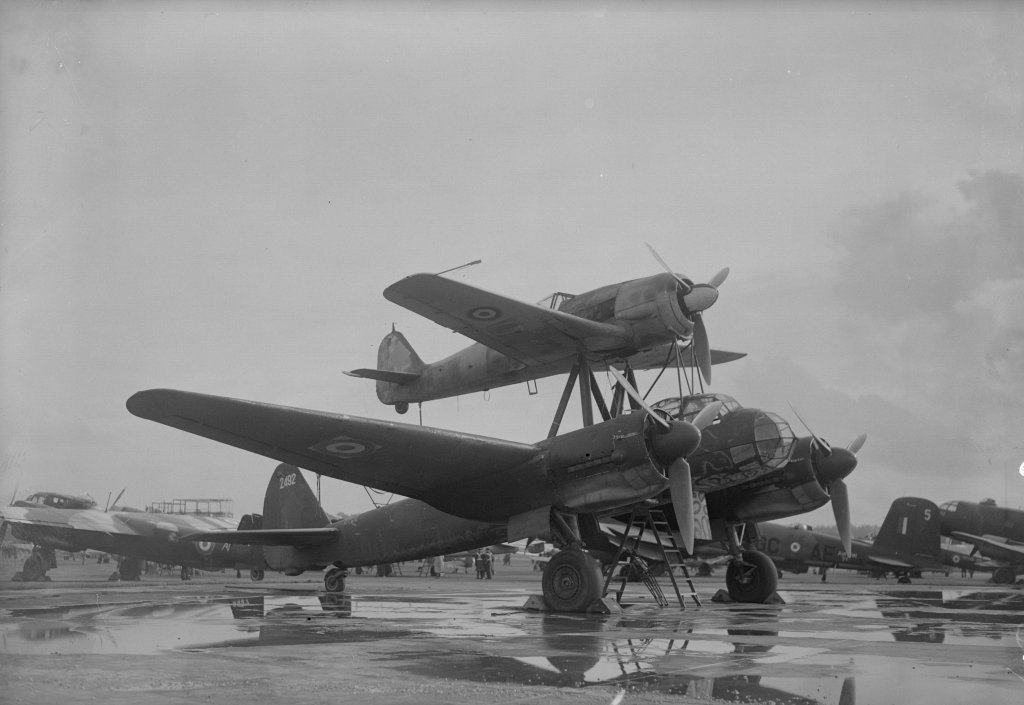 30th October 1945: An obsolete Junkers JU 88 transport plane with a Focke-Wulf FW 190 fighter on top, at a display of British and German aircraft at the Royal Aircraft Establishment, Farnborough, England. This This aircraft combination was known as a Mistel or Father-and-Son. (Photo by Fox Photos/Getty Images)