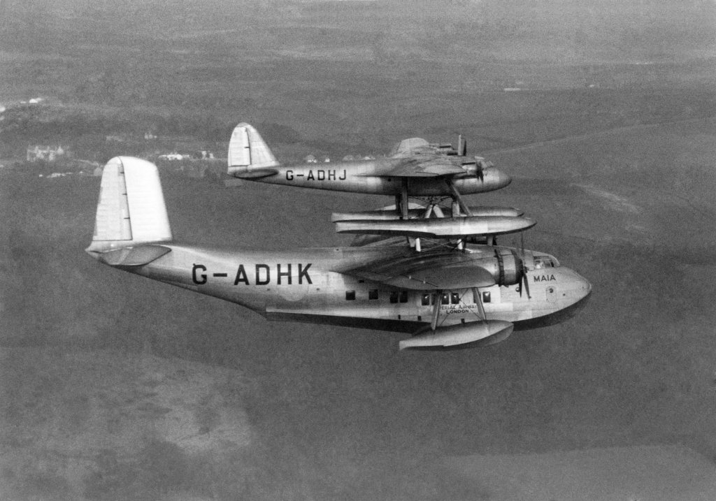 The idea was to launch the heavily loaded mail plane Mercury from the back of the lightly loaded Maia after the combination had climb to cruising level. The Maia was an adapted Short S.30 Empire flying boat. Flying trials began in early 1938 with the first separation on 6 February and the first long-distance flight was made from Foynes in Ireland on 20 July. Captain Don Bennett (who became a famous W.W.2 Pathfinder pilot) then flew Mercury on to Montreal, a distance of 2930 miles in 20 hours 20 minutes. He later flew south to New York where Mercury was reunited with Maia. WW2 put paid to any further development of this interesting conception. February 1938 P004825 (Photo by WATFORD/Mirrorpix/Mirrorpix via Getty Images)