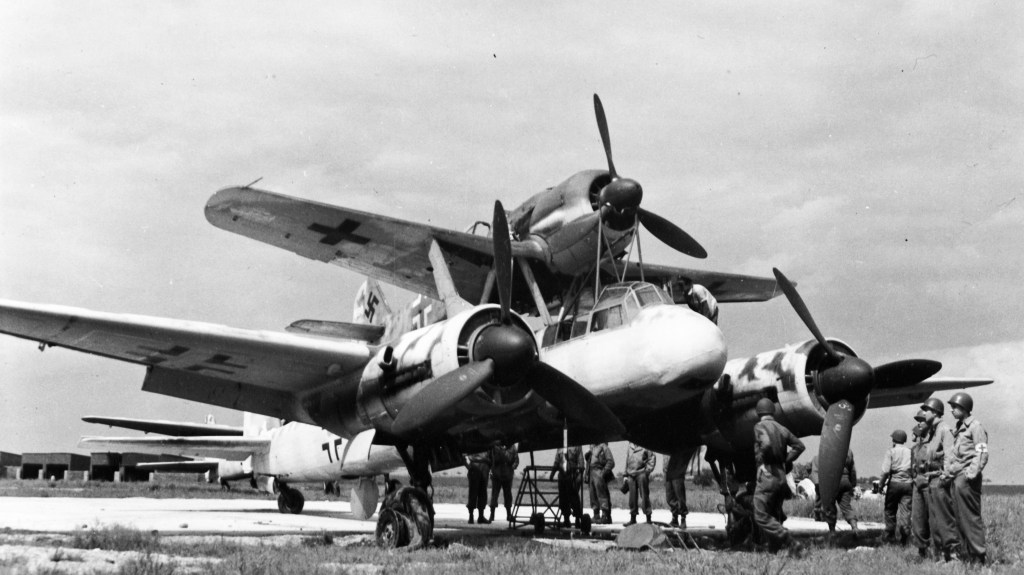 Under the plan known as Mistel (meaning mistletoe, a parasitic plant that grows on a tree), war-weary Junkers Ju 88 bombers would be adapted to become pilotless missiles, onto which would be attached piloted Messerschmitt Bf 109 or Focke-Wulf Fw 190 fighters. The composite aircraft would launch under the control of the fighter and be brought to the target, after which the bomber/missile component would be released, leaving the fighter free to (hopefully) return to base.