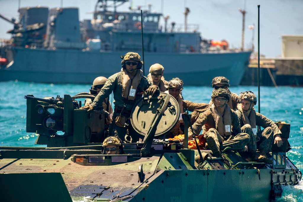 U.S. Marines assigned to Alpha Company, Battalion Landing Team 1/5, 15th Marine Expeditionary Unit, prepare to conduct a troop transfer during an Amphibious Combat Vehicle egress drill at White Beach Naval Facility, Okinawa, Japan, June 24, 2024. Harpers Ferry and embarked elements of the 15th MEU are conducting routine operations in the U.S. 7th Fleet area of operations. 7th Fleet is the U.S. Navy’s largest forward-deployed numbered fleet, and routinely interacts and operates with allies and partners in preserving a free and open Indo-Pacific region. (U.S. Marine Corps photo by Lance Cpl. Peyton Kahle)
