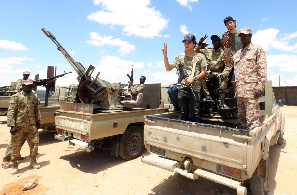 Fighters loyal to the UN-recognised Libyan Government of National Accord (GNA) secure the area of Abu Qurain, half-way between the capital Tripoli and Libya's second city Benghazi, against forces loyal to Khalifa Haftar, who is based in eastern Benghazi, on July 20, 2020. - Since 2015, a power struggle has pitted the (GNA) against forces loyal to Haftar. The strongman is mainly supported by Egypt, the United Arab Emirates and Russia, while Turkey backs the GNA. (Photo by Mahmud TURKIA / AFP) (Photo by MAHMUD TURKIA/AFP via Getty Images)