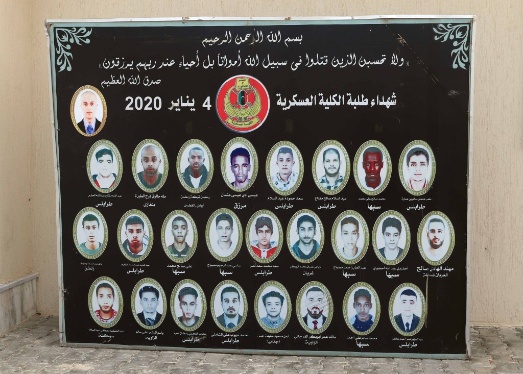 TRIPOLI, LIBYA - JANUARY 04: Pictures of the twenty-six students who were killed in Haftar forces' drone attacks in a Hadba military school, are seen during the remembrance to mark first anniversary of the attack in Tripoli, Libya on January 04, 2021. (Photo by Hamza Al Ahmar/Anadolu Agency via Getty Images)