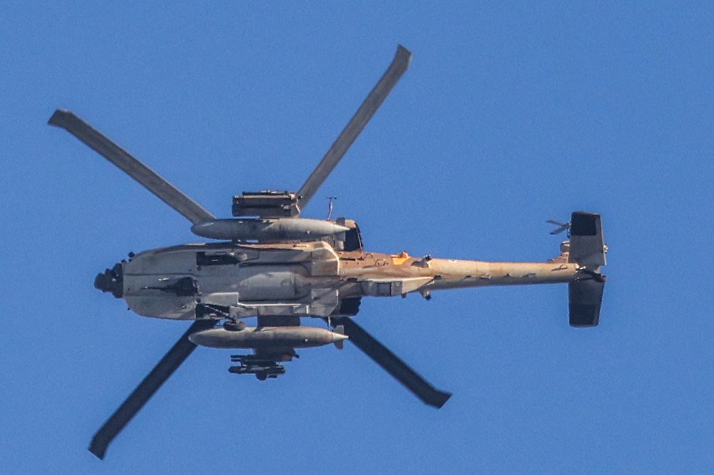 An Israeli air force attack helicopter flies over the border with the Gaza Strip near southern Israel on November 8, 2023 amid ongoing battles between Israel and the Palestinian Hamas movement. (Photo by JACK GUEZ / AFP) (Photo by JACK GUEZ/AFP via Getty Images)