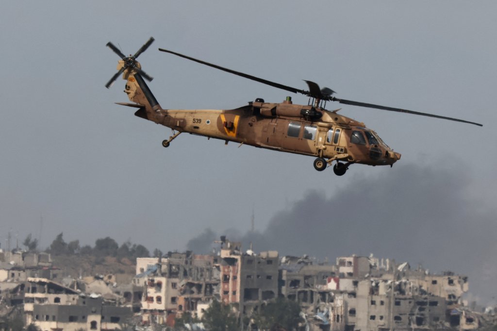 A picture taken from southern Israel near the border with the Gaza Strip on December 9, 2023, shows an Israeli military rescue helicopter arriving to rescue soldiers, amid continuing battles with the militant group Hamas in the Palestinian territory. (Photo by JACK GUEZ / AFP) (Photo by JACK GUEZ/AFP via Getty Images)