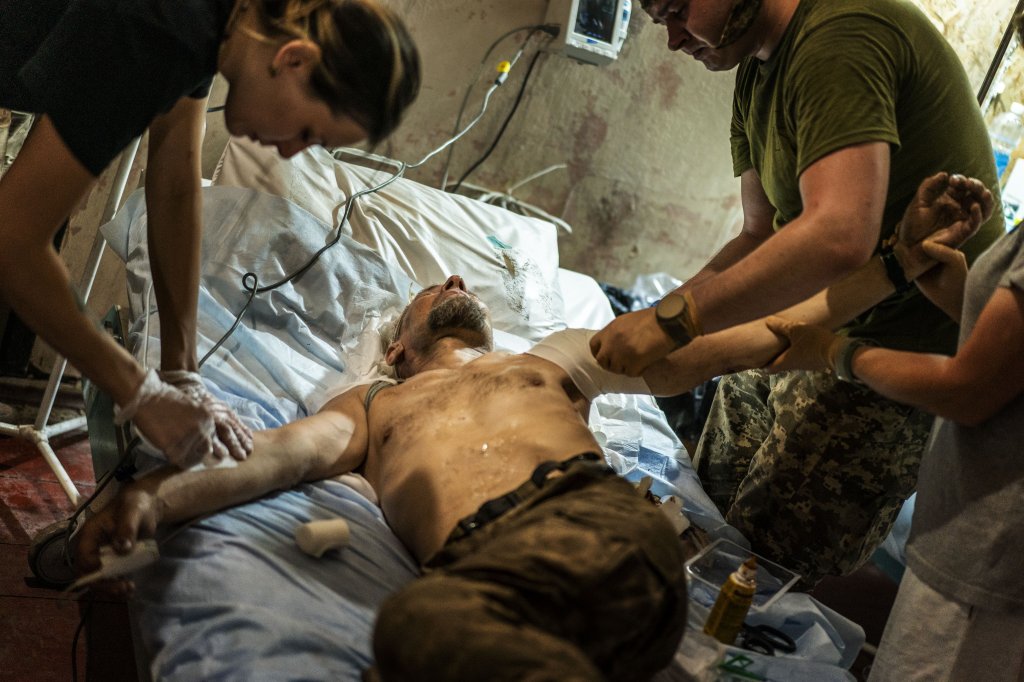 DONETSK OBLAST, UKRAINE - JULY 17: Ukrainian army medics treat a wounded soldier at a stabilization point as the war between Russia and Ukraine continues, in the direction of Pokrovsk frontline, Donetsk Oblast, Ukraine, July 17, 2024. (Photo by Jose Colon/Anadolu via Getty Images)