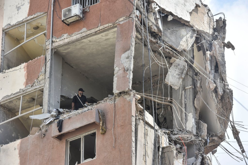 A view is showing a partially destroyed building, which is being targeted by the Israeli army, in Beirut, Lebanon, on July 31, 2024. The Israeli army is also claiming that it is killing key Fuad Shukr, Hezbollah's top military commander, in the strike. (Photo by Fadel Itani/NurPhoto via Getty Images)