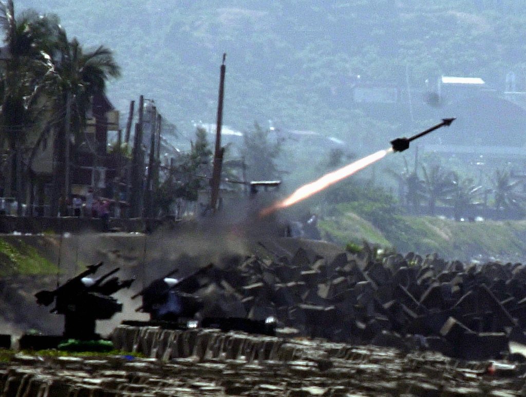 PINGTUNG, TAIWAN: Taiwanese navy tests fire a US-made sidewinder missile during a military exercise in Pingtung, southern Taiwan, 14 October 2003. The exercise was held to test navy''s weapon system. AFP PHOTO/Patrick LIN (Photo credit should read PATRICK LIN/AFP via Getty Images)