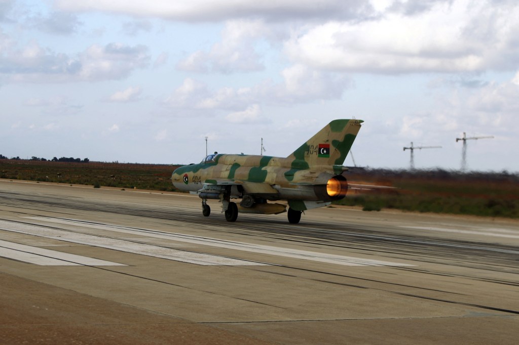 Jamal bin Amer, a Libyan pilot of the armed forces loyal to Libya's internationally recognised government, takes off in his fighter jet before hitting positions of armed factions, notably Islamists, on December 10, 2015 at Benina air base some 15km south of Libya's eastern coastal city of Benghazi. Pro-government forces have fought an array of armed factions for control of Libya's second city for the past 18 months. AFP PHOTO / ABDULLAH DOMA (Photo by ABDULLAH DOMA / AFP) (Photo by ABDULLAH DOMA/AFP via Getty Images)