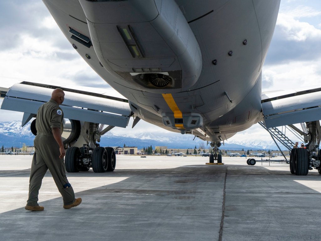 U.S. Air Force Maj. Will Watson, a pilot assigned to the 905th Air Refueling Squadron from McConnell Air Force Base, Kan., conducts a pre-flight check on a KC-46A Pegasus aircraft, assigned to the 931st Air Refueling Wing, prior to take off from Joint Base Elmendorf-Richardson, Alaska, May 11, 2021, in support of exercise Northern Edge 2021. Approximately 15,000 U.S. service members are participating in a joint training exercise hosted by U.S. Pacific Air Forces May 3-14, 2021, on and above the Joint Pacific Alaska Range Complex, the Gulf of Alaska, and temporary maritime activities area. NE21 is one in a series of U.S. Indo-Pacific Command exercises designed to sharpen the joint forces’ skills; to practice tactics, techniques, and procedures; to improve command, control and communication relationships; and to develop cooperative plans and programs. (U.S. Air Force photo by Senior Airman Adriana Barrientos)