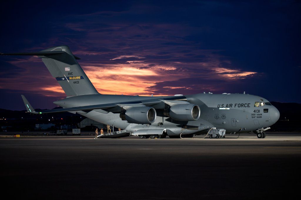 A C-17 Globemaster III assigned to the 305th Air Mobility Wing sits on the flightline during Bamboo Eagle (BE) 24-3 at at Nellis Air Force Base, Nevada, Aug. 2, 2024. Through the use of designated air space, BE 24-3 provides Airmen, allies and partners a flexible, combat-representative, multidimensional battle space to conduct testing, tactics development, and advanced training in support of U.S. national interests. (U.S. Air Force photo by Airman 1st Class Brianna Vetro)