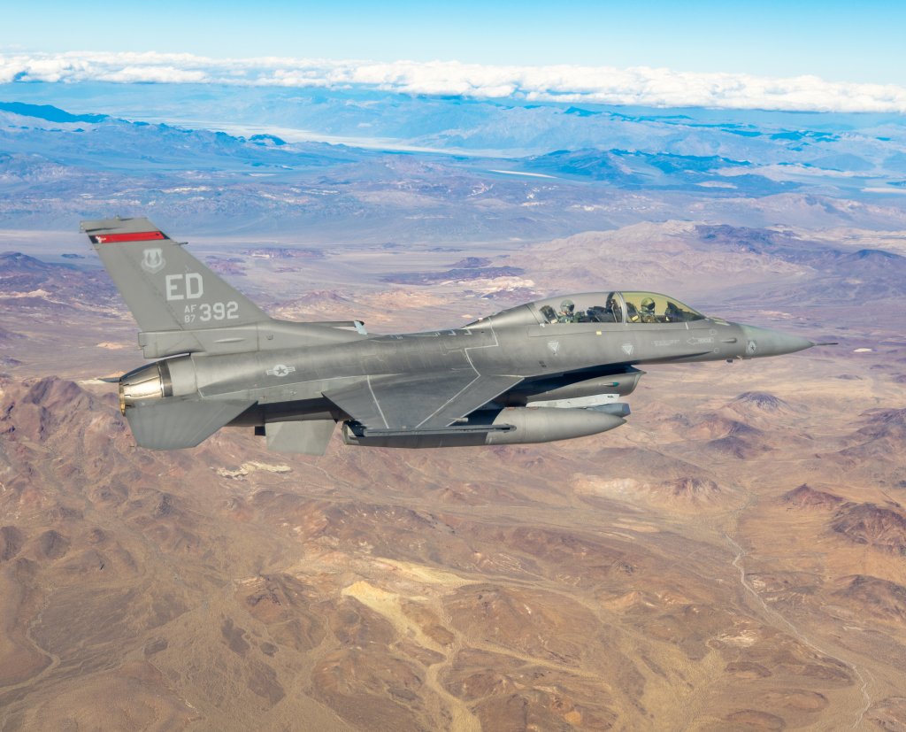 412th Test Wing aerial photographer Bryce Bennett flies a Photo Chase mission in the back seat of F-16D tail number 87-392 while supporting 416th Flight Test Squadron test activities November 7, 2023 at Edwards Air Force Base, California. (Air Force photo by Todd Schannuth)