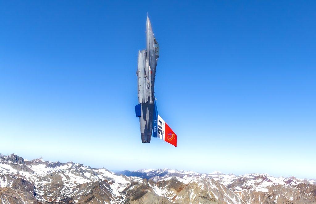 Edwards AFB F-16C 88-456 with its special 50th Anniversary Fighting Falcon tail flash goes vertical on the Sidewinder Low Level Route in Owens Valley near Mt. Whitney, California, June 5, 2024. This Viper is assigned to the 416th Flight Test Squadron, flown by outgoing 416th FLTS Commander Lt. Col. Michael Pacini on his last flight with the Skulls. (Air Force photo by Todd Schannuth)