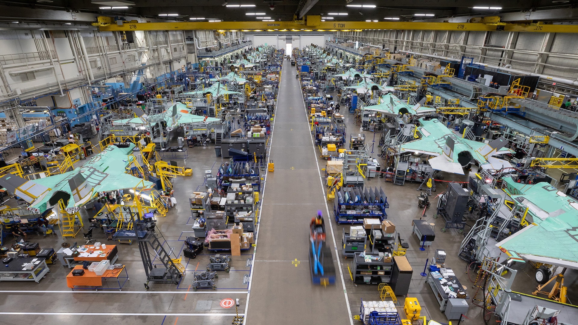 Lockheed Martin Aeronautics Company - Fort Worth - Chris Hanoch Subject: Document F-35 production line from crane monorail FP#: 20-16433 POC: Shane Nicholson Other info: Monorail, crane, F-35 production line; Brett Ashworth This image is public release approved per Angel DelCueto on 05/05/2021