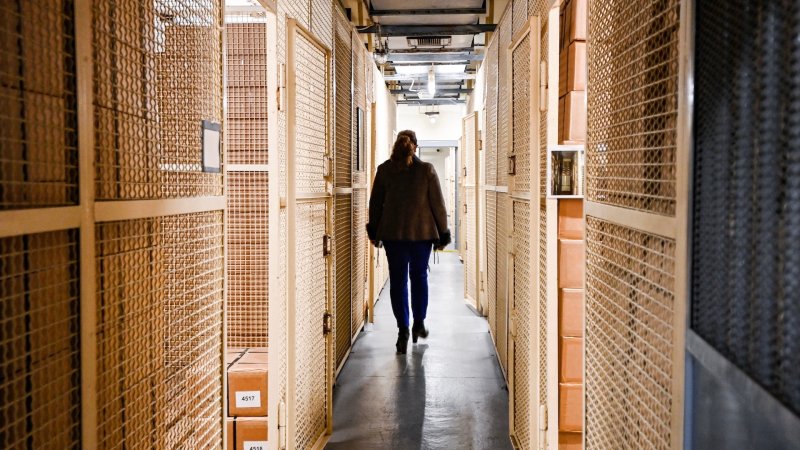 Petra Reuter, owner of the Bundesbank Bunker Museum, walks past storage rooms for the substitute currency in the former vault of the bunker museum in Cochem, western Germany on February 8, 2022. The Bundesbank Bunker was a bunker of the German Federal Bank in Cochem for the storage of an emergency currency. From 1964 to 1988, up to 15 billion marks were stored in the top-secret facility to protect Germany from a national economic crisis in the event of hyperinflation caused by the Cold War. (Photo by Ina FASSBENDER / AFP) (Photo by INA FASSBENDER/AFP via Getty Images)