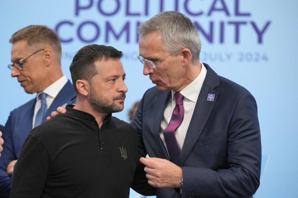 WOODSTOCK, ENGLAND - JULY 18: Ukrainian President Volodymyr Zelenskyy, (L) speaks to the Nato Secretary General Jens Stoltenberg before the first plenary session at the European Political Community summit at Blenheim Palace on July 18, 2024 in Woodstock, England. At the 4th European Political Community Summit, Europe's leaders will focus on energy, infrastructures, connectivity, cybersecurity, countering disinformation and migration. (Photo by Kin Cheung - WPA Pool/Getty Images)