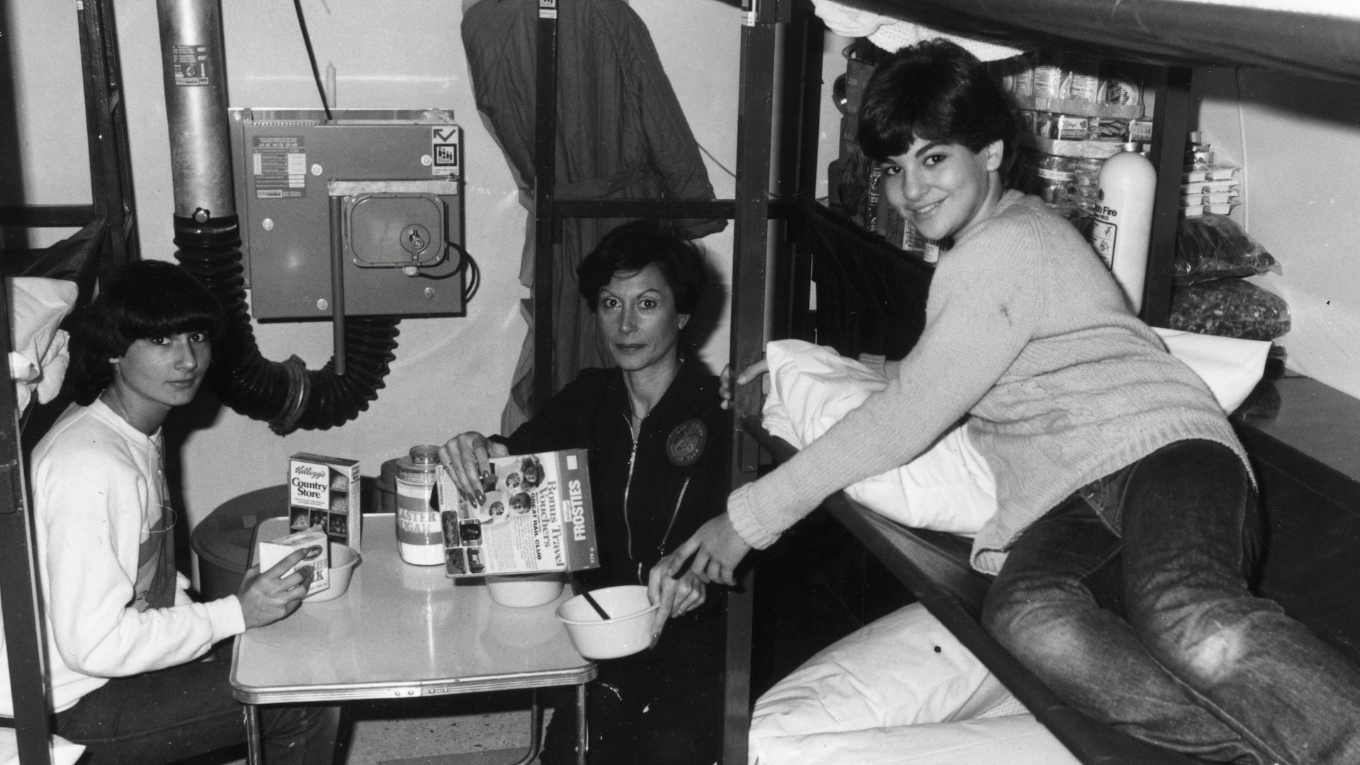 The nuclear family. October 21, 1980. Phyllis Millet and her daughters Roberta and Katie (right) having breakfast in their underground nuclear shelter during a five-day trial. Photo by Graham Turner/Keystone/Getty Images.