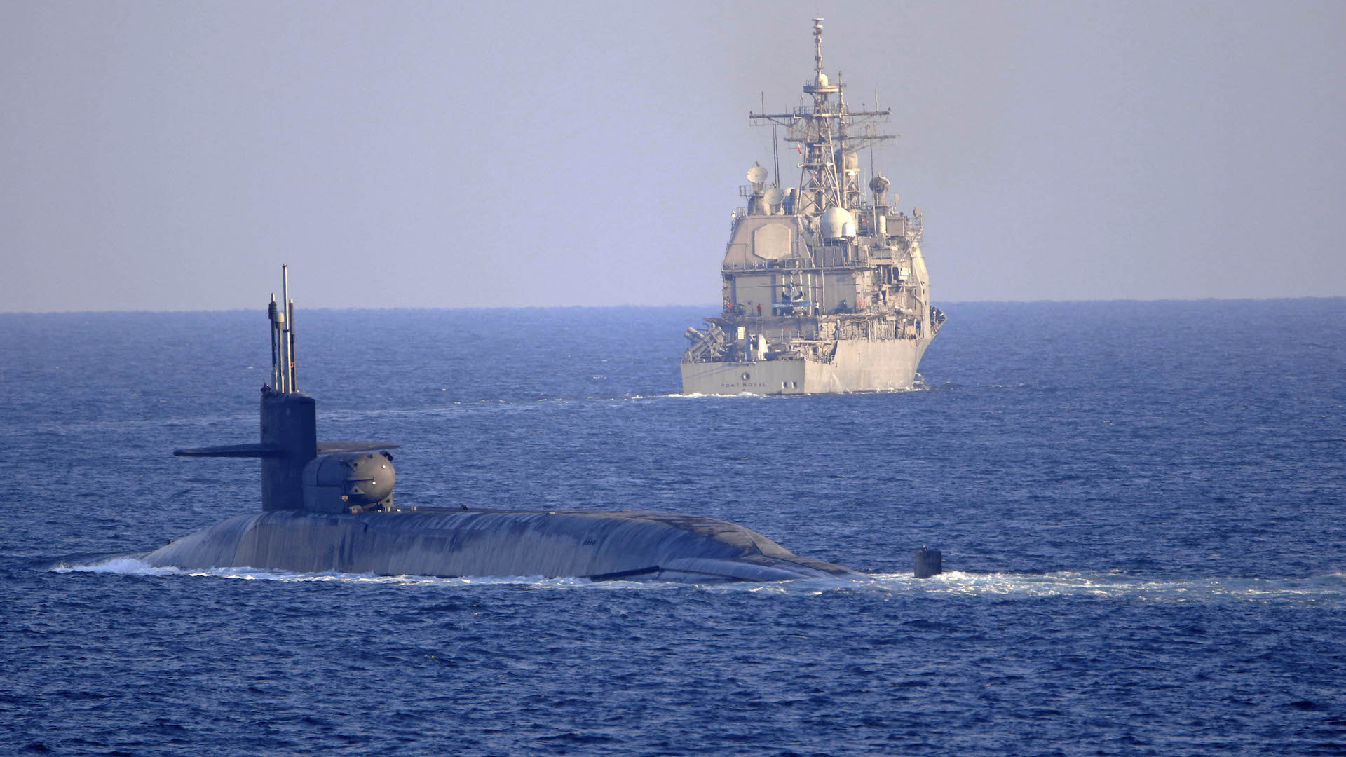 The Ohio-class, guided-missile submarine USS Georgia (SSGN 729) transits with the Ticonderoga-class guided-missile cruiser USS Port Royal (CG 73) and the Ticonderoga-class guided-missile cruiser USS Philippine Sea (CG 58), not shown, on the Strait of Hormuz, Dec. 21. Philippine Sea is deployed to the U.S. 5th Fleet area of operations in support of naval operations to ensure maritime stability and security in the Central Region, connecting the Mediterranean and Pacific through the Western Indian Ocean and three critical chokepoints to the free flow of global commerce.