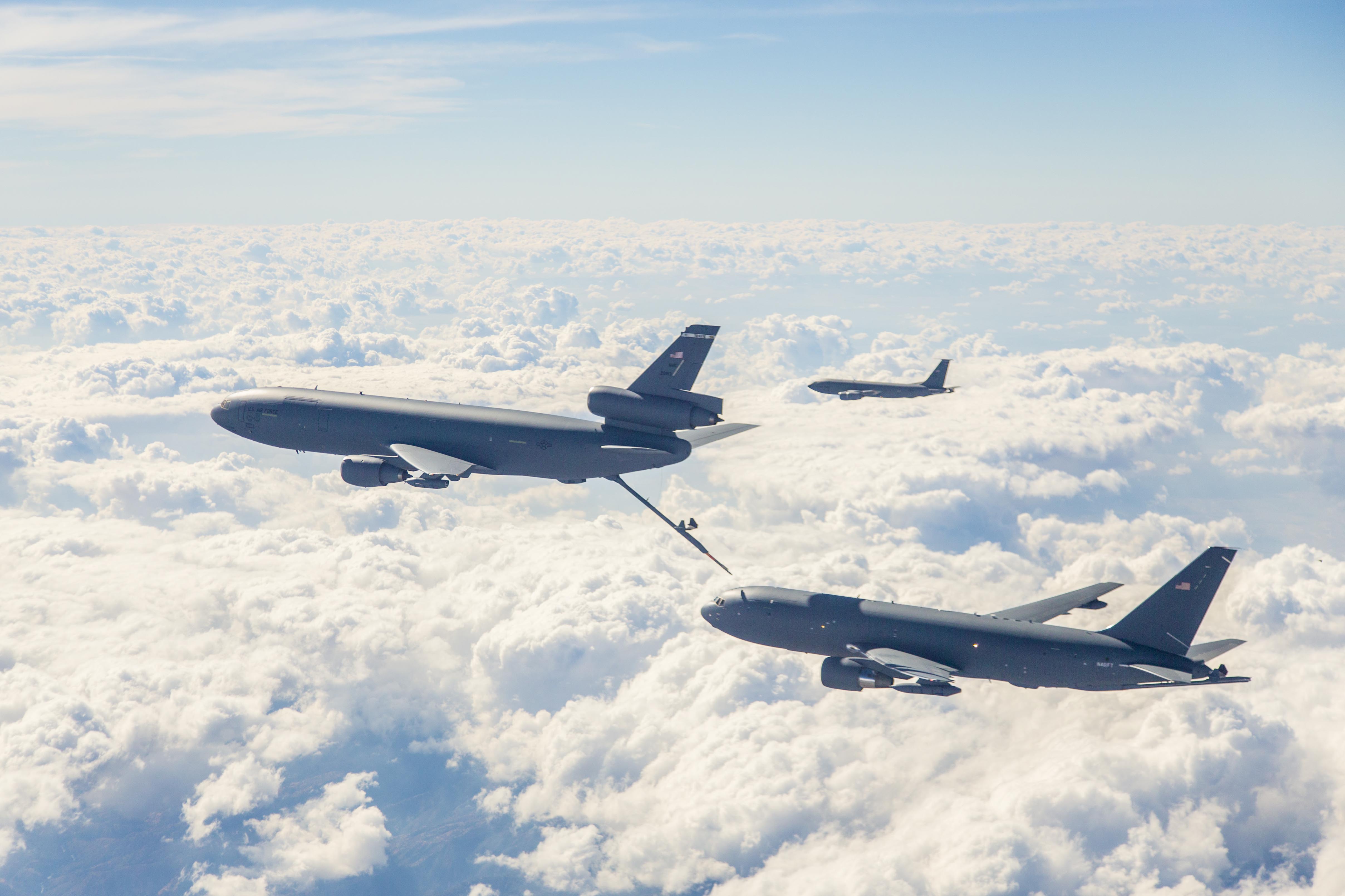 151019-F-HP195-037 OWENS VALLEY, Calif. (Oct. 19, 2015) Photos of Boeing's KC-46A, lower right, conducting tests of aircraft acceleration and vibration exposure while flying in receiver formation at various speeds and altitudes behind either the KC-10 Extender or the KC-135 Stratotanker. Testing for this phase was coordinated from Edwards Air Force Base, Calif., and conducted above Owens Valley and parts of the western Mojave Desert.