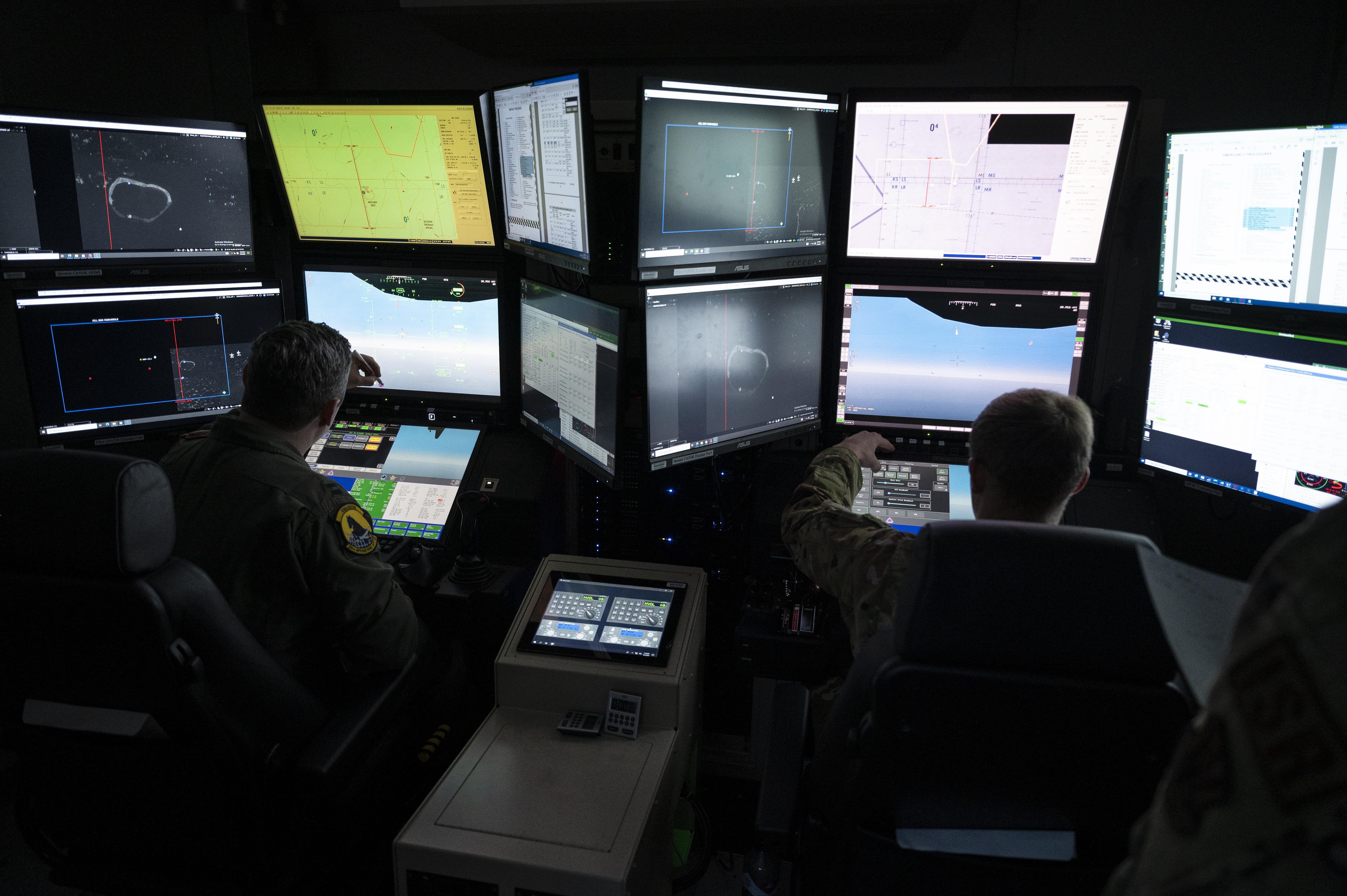 U.S. Air Force MQ-9 pilot, left, and sensor operator, right, assigned to the 25th Operations Support Squadron participate in Reaper Smoke 2024 at Hurlburt Field, Florida, Sept. 5, 2024. During the event more than 20 MQ-9 Reaper units from across all three components of the U.S. Air Force put their skills to the test to see who among them was the “best of the best.” (U.S. Air Force photo by Senior Airman Deanna Muir)