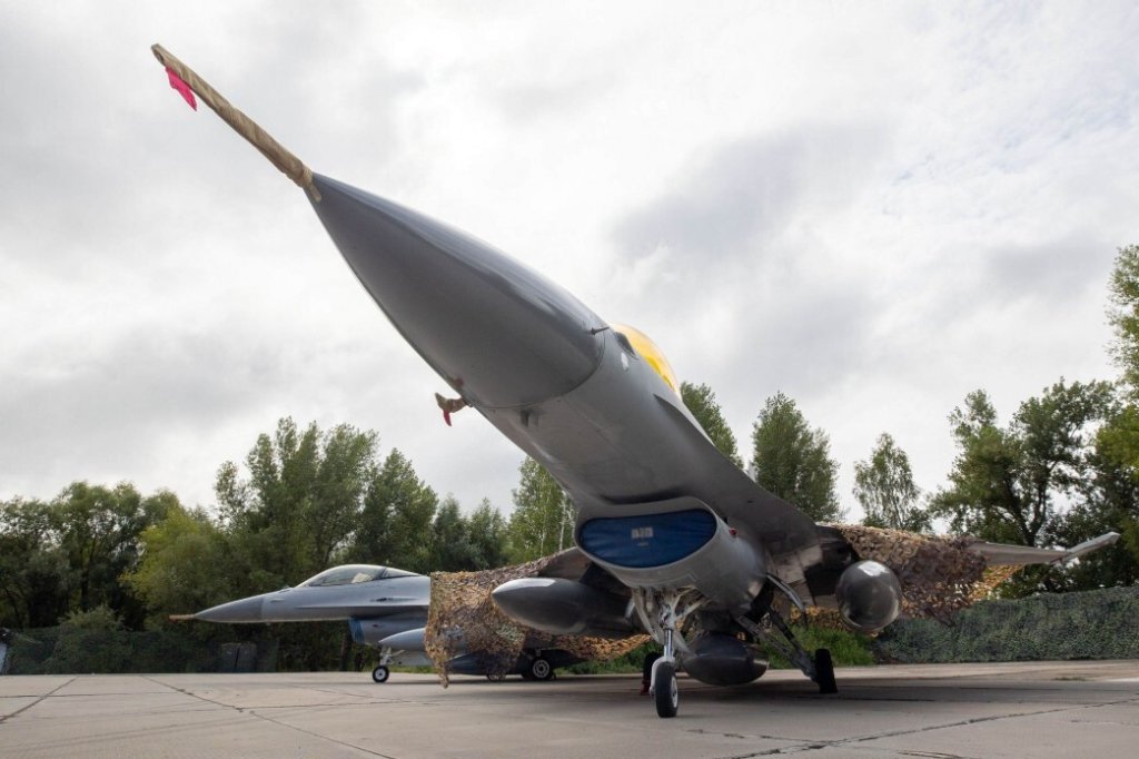 UKRAINE - AUGUST 4: (----EDITORIAL USE ONLY - MANDATORY CREDIT - UKRAINIAN PRESIDENCY / HANDOUT' - NO MARKETING NO ADVERTISING CAMPAIGNS - DISTRIBUTED AS A SERVICE TO CLIENTS----) F-16 Fighting Falcons are seen as President of Ukraine Volodymyr Zelensky delivers a speech congratulating the Ukrainian military on the stand in front of the first General Dynamics F-16 Fighting Falcon received by Ukraine on August 4, 2024 in, Ukraine. The first General Dynamics F-16 Fighting Falcons received by Ukraine were demonstrated at the Ukrainian Air Force Day event attended by President of Ukraine Volodymyr Zelensky. (Photo by Ukrainian Presidency/Handout/Anadolu via Getty Images)