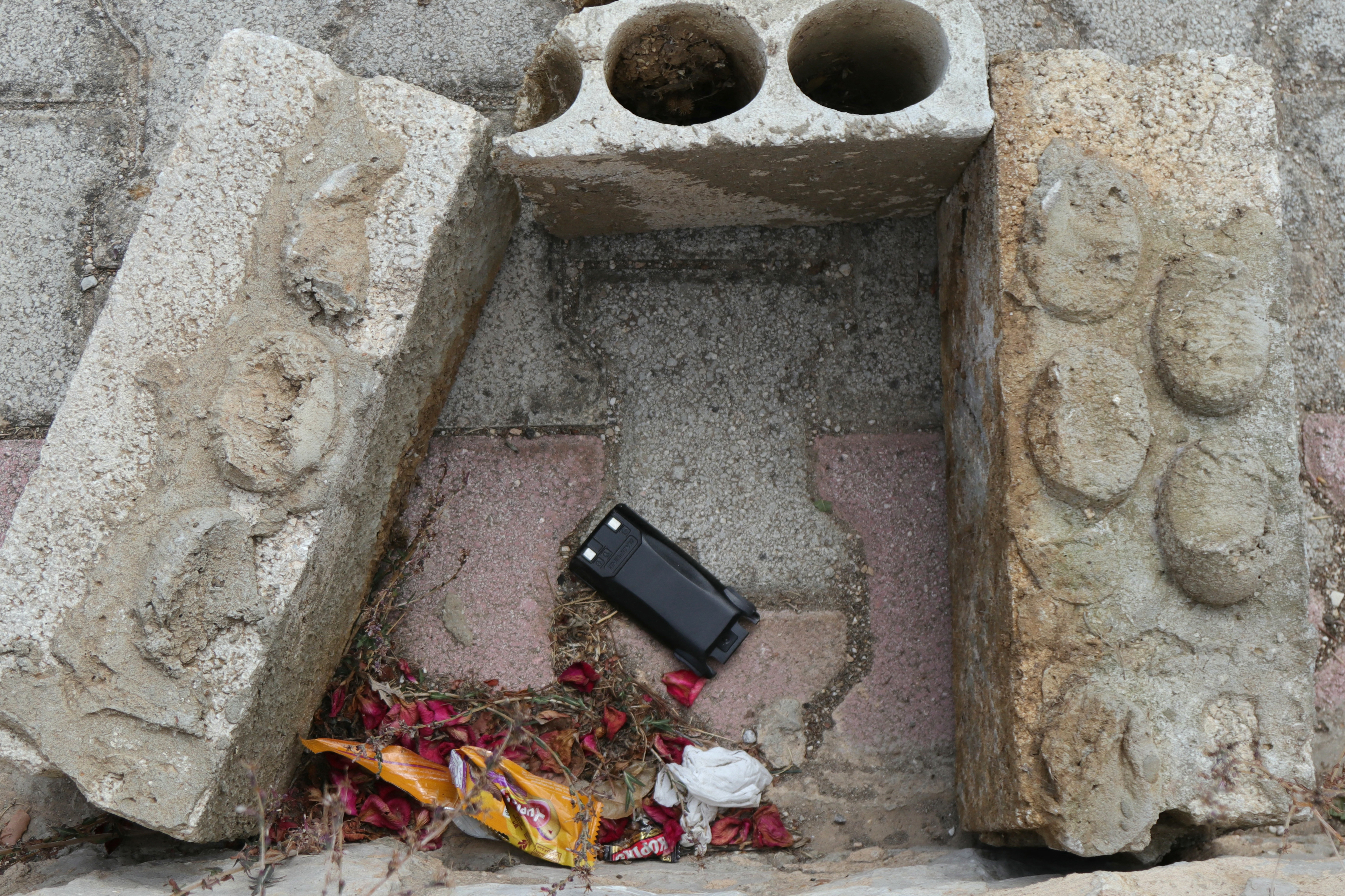 This picture shows a communication device on the ground as Lebanese army forces (not in the picture) prepare to destroy it in a controlled explosion, in southern Lebanon between the villages of Burj al Muluk and Klayaa, on September 19, 2024. Hundreds of pagers and walkie-talkies used by Hezbollah exploded across Lebanon in unprecedented attacks that spanned two days, killing 32 people and wounding more than 3,000 others. (Photo by Rabih DAHER / AFP) (Photo by RABIH DAHER/AFP via Getty Images)