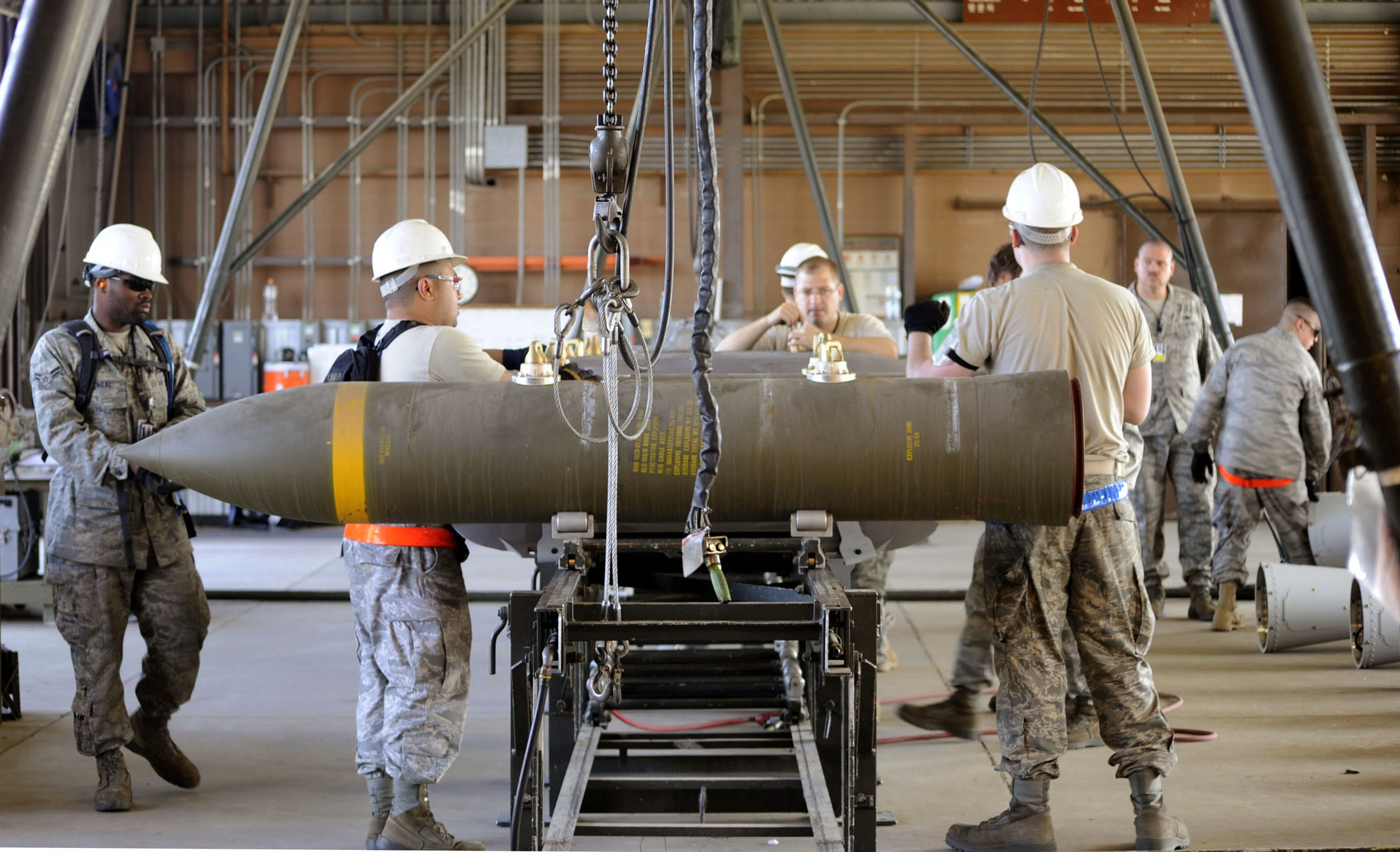 Multiple munitions maintainers from around the Pacific assemble BLU-109 munitions in the small bomb pad during the Combat Ammunitions Production Exercise May 25, 2010, at Osan Air Base, South Korea. CAPEX is a non-rated exercise held once a year in the Pacific Air Forces region. It provides training on non-nuclear reserve munitions production in integrated tasks orders and planning. (U.S. Air Force photo/Staff Sgt. Stephenie Wade)