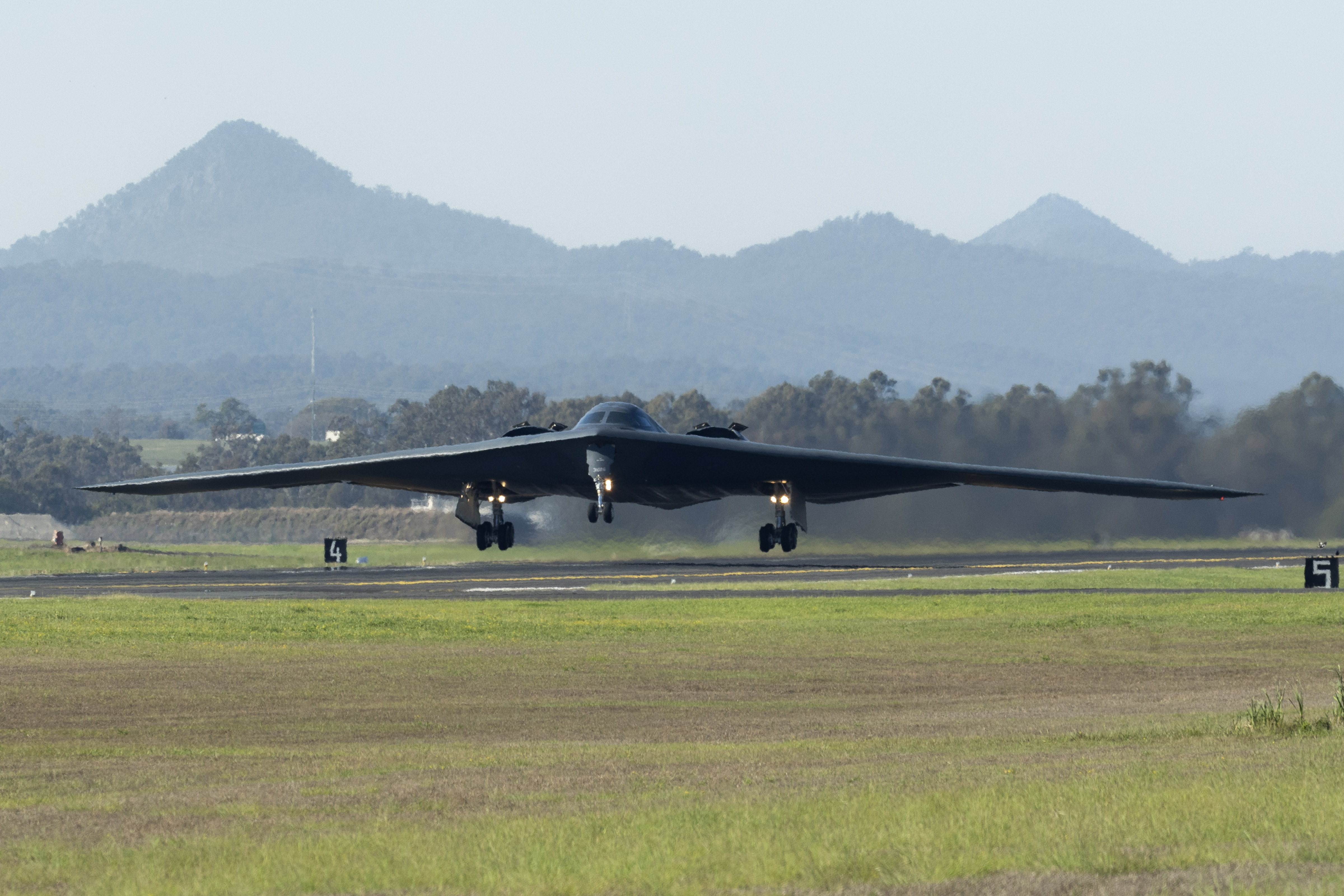 A United States of America B2 Spirit Bomber takes off at RAAF Base Amberley. *** Local Caption *** During August and September 2024, as part of the Enhanced Air Cooperation Program (EAC), USAF deployed a flight of B-2 Spirit Stealth Bombers and personnel from 110th Expeditionary Bob Squadron (EBS) to operate out of RAAF Base Amberley on a Bomber Task Force (BTF) mission. 110EBS is part of 509th Bomber Wing. Whilst deployed the B-2 aircraft worked closely with air assets of the RAAF enhancing interoperability and bolstering the collective ability to support and free and open Indo-Pacific. [Imagery supplied by USAF and managed by LACW Nell Bradbury].