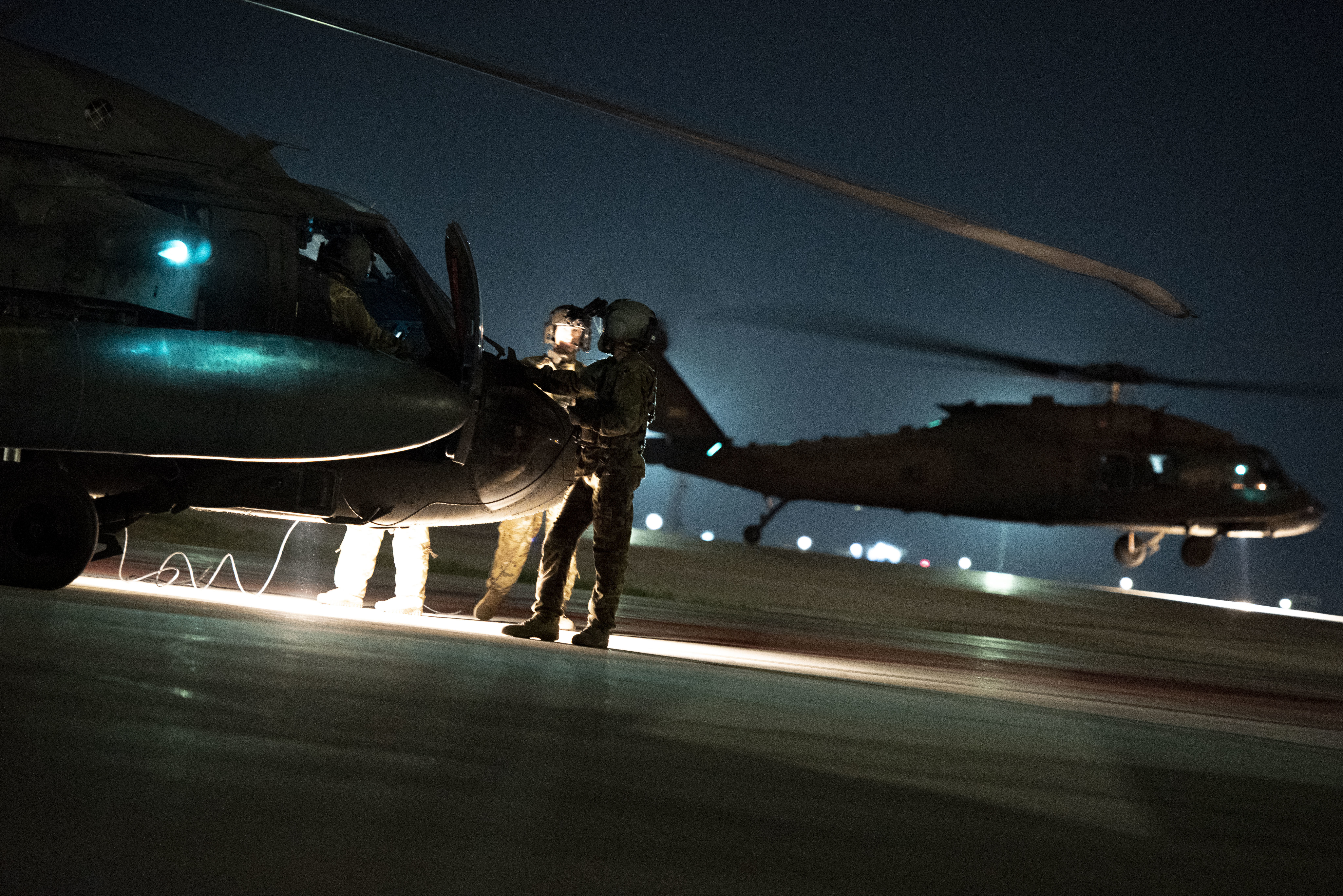 U.S. Army Soldiers from Task Force Black Cat inspect a UH-60 Black Hawk during a joint K-9 helicopter training mission at Incirlik Air Base, Turkey, Sept. 13, 2021. During the mission, military working dog handlers from the 39th Security Forces Squadron conducted medical evacuations on simulated K-9 casualties and other mission-specific tasks required for real-world operations. This interservice training with the Army enabled them to acclimate their K-9s to helicopter operations under combat conditions. Task Force Black Cat ensures the mobility of the joint warfighter in support of U.S. European Command and U.S. Central Command missions throughout Turkey and the wider region. Task Force Black Cat is one of many tenant units that partner with the 39th Air Base Wing to promote security and stability in the region. (U.S. Air Force photo by Staff Sgt. Jacob Derry)