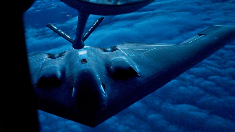 A B-2 Spirit from the 509th Bomb Wing, 13th Bomb Squadron Whiteman Air Force Base, Miss., prepares to be refueled by a KC-135R Stratotanker from the 434th Air Refueling Wing at Grissom Air Reserve Base, Ind. during a nighttime aerial refueling mission.